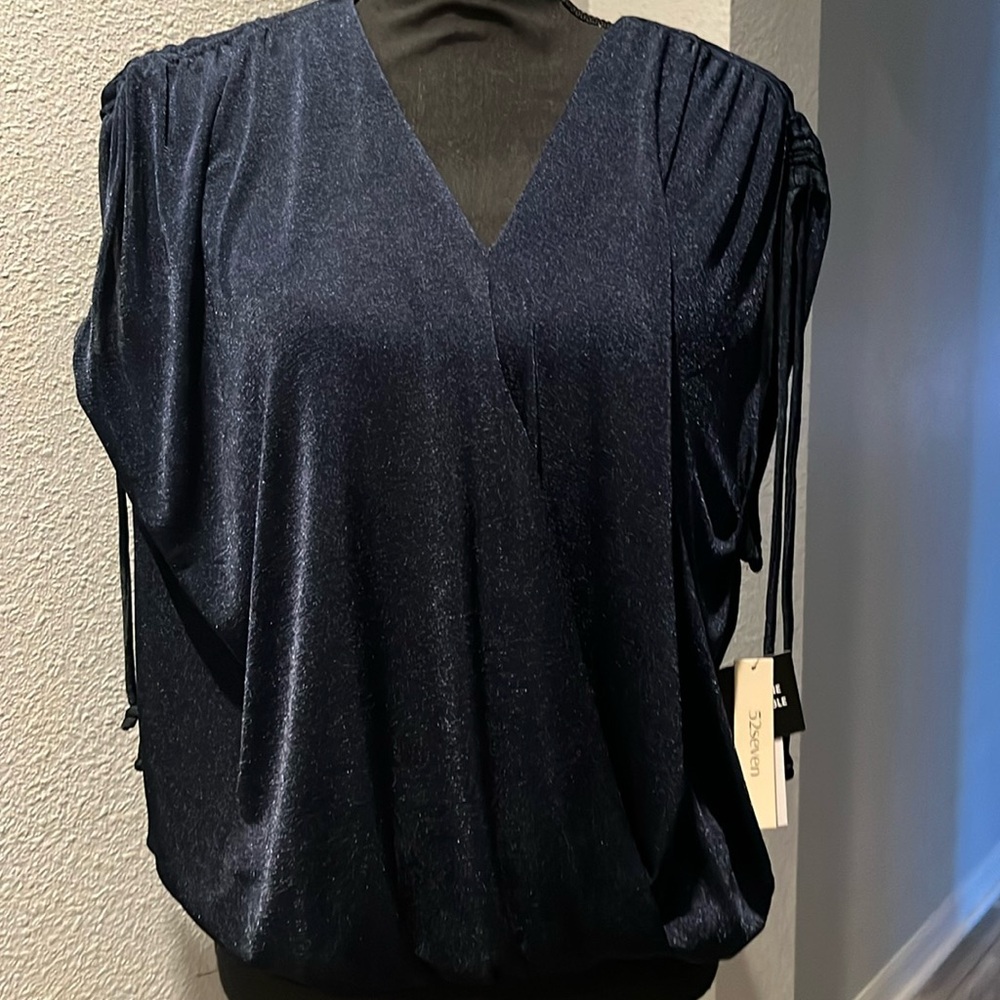 Beautiful navy blouse made by 52 seven great detail on shoulders,elastic waist